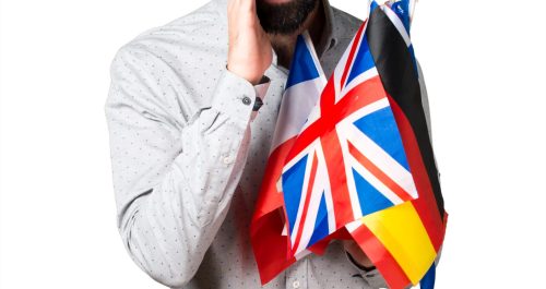 Handsome man with beard holding many flags and shouting